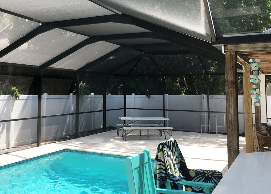 Pombos_Tampa-Bay-Florida-Screen-Enclosures_Services_Pool-Enclosures_Tabs-2 Screened-in pool enclosure creating an outdoor retreat
