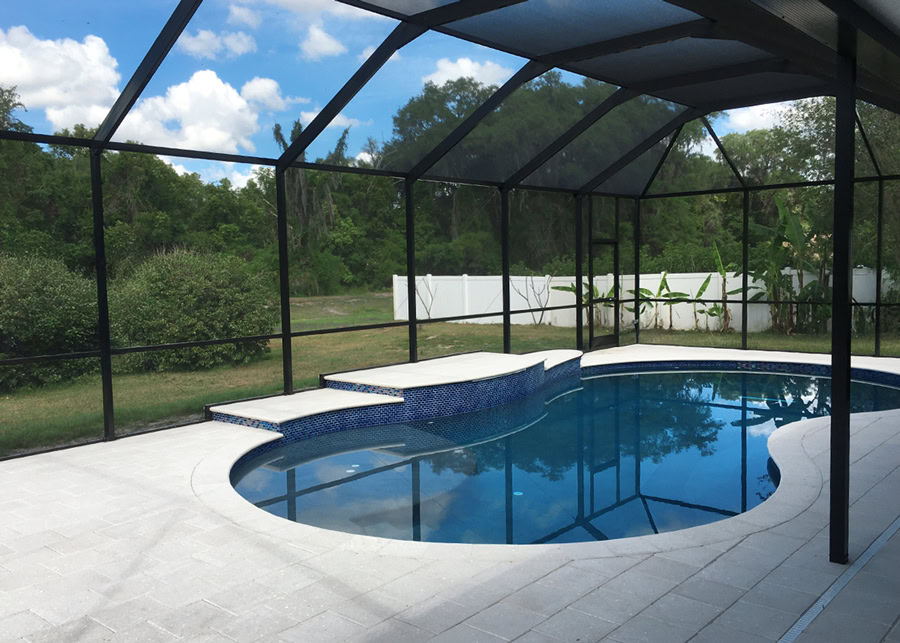 Tampa Bay backyard with a swimming area protected by pool enclosure