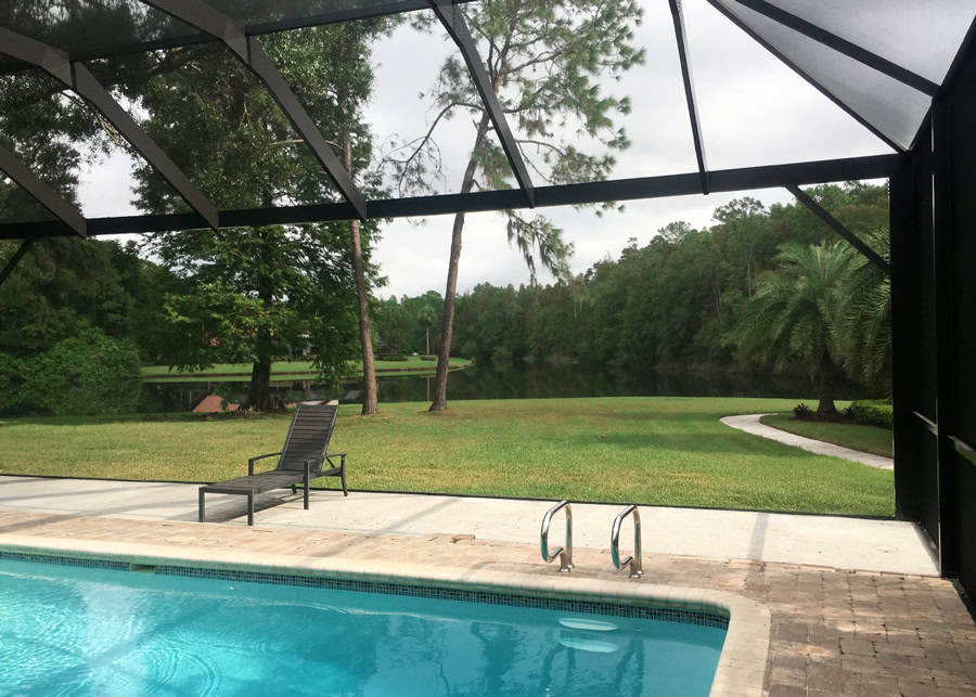 Screened pool enclosure designed to block debris and insects