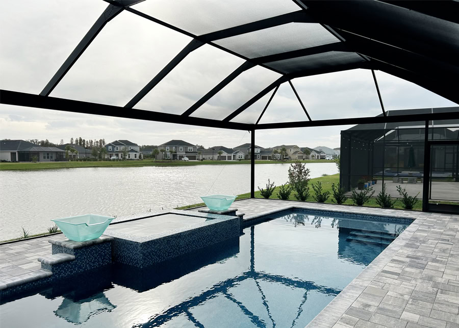 Modern pool cage with panoramic screens and durable framing