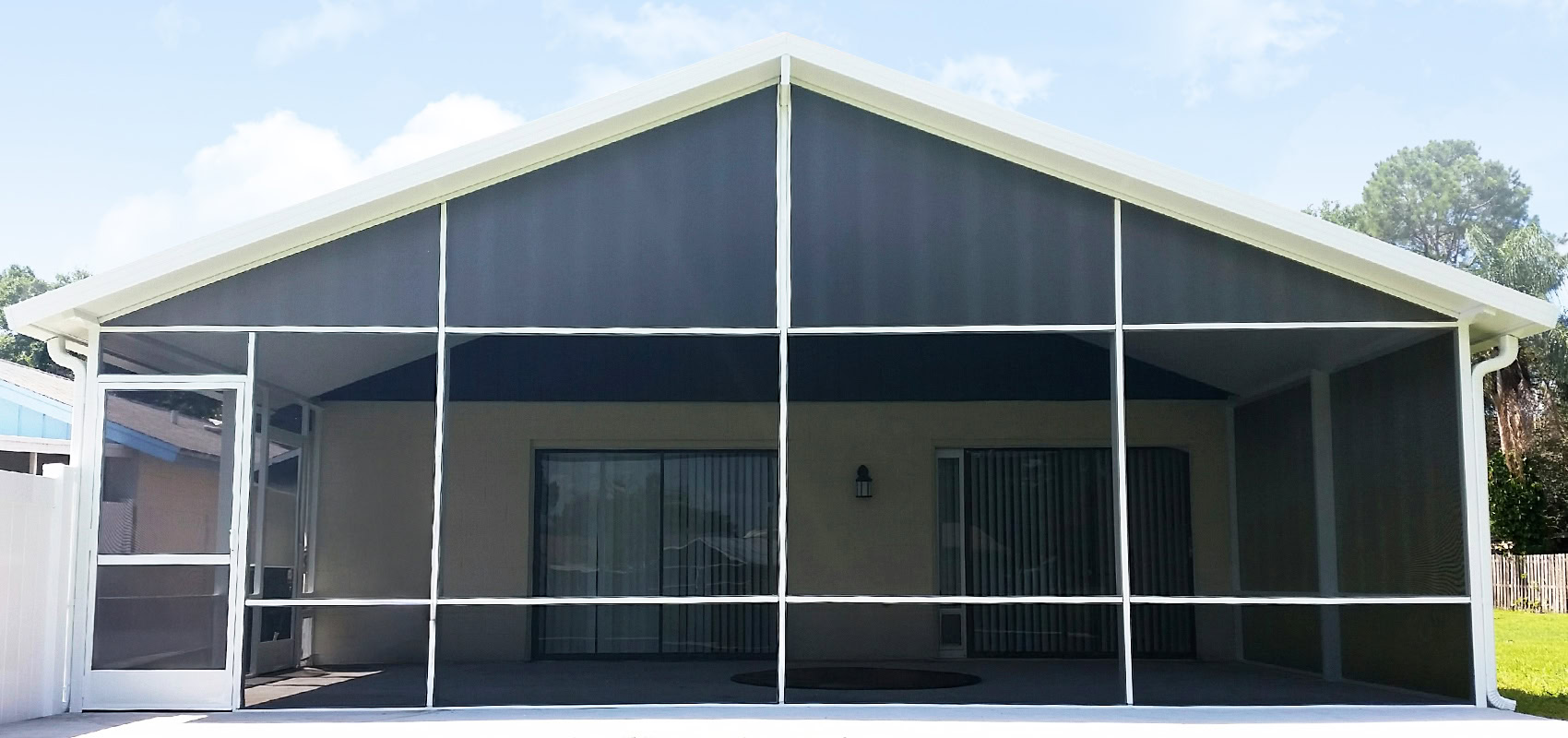 Pombos_Tampa-Bay-Florida-Screen-Enclosures_Banner_Screened-In-Porches_v23 Screened-in porch providing shade and insect protection for Florida homes